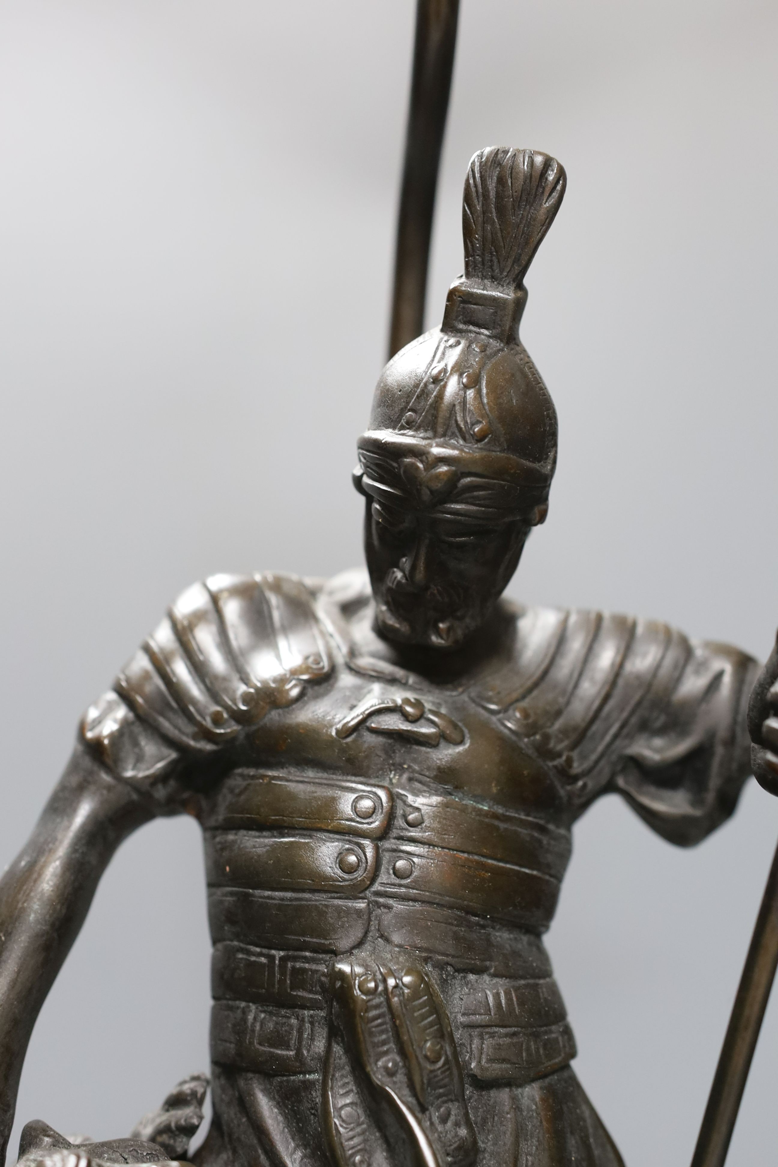 A bronze ‘gladiator’ lamp base. Total height 62cm